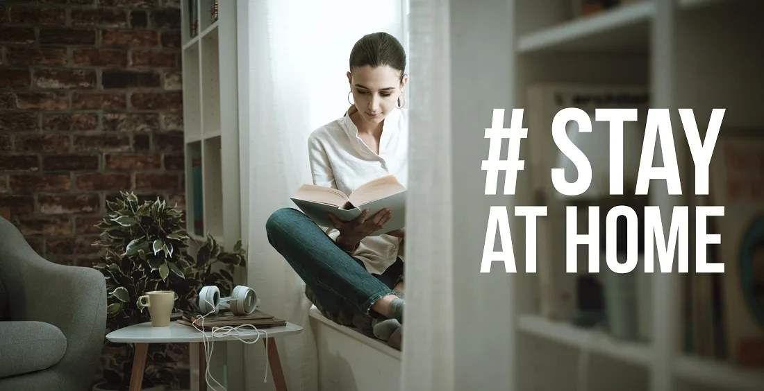 Person meditating near a window or on a yoga mat